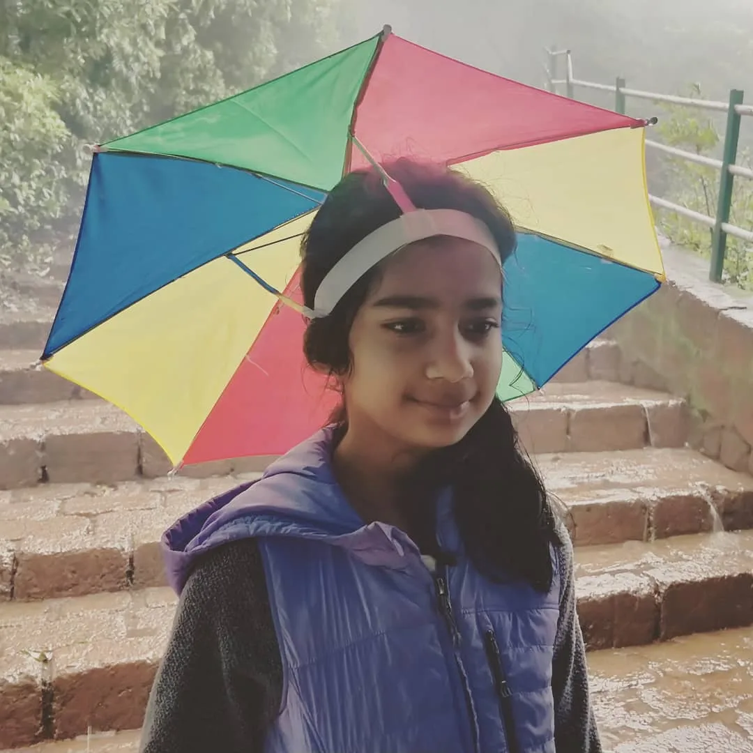 S2 in a cute umbrella hat.