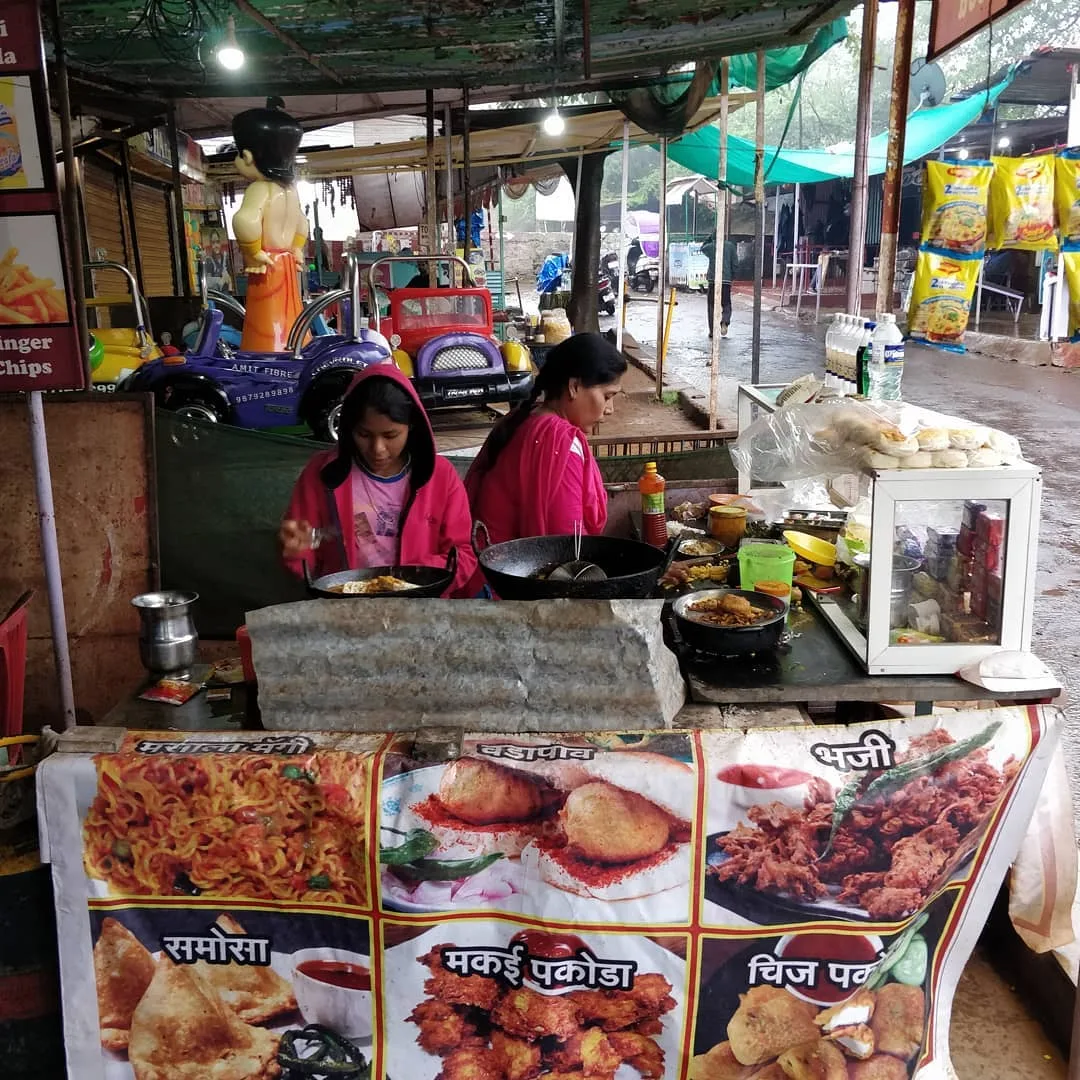 The happiest café owner ever. She was delighted to have the opportunity to feed all the children, and did remarkably well.