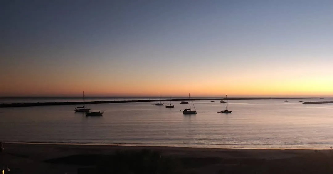 #boats against a setting sun