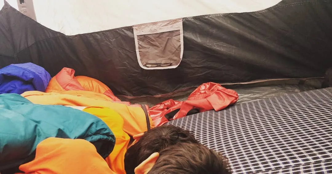 In a hurry last night, we had pitched tent on a slight slope. The upper half is on a slope, the lower half is flat.

When we tried sleeping, we were rolling all over the place 😂. S