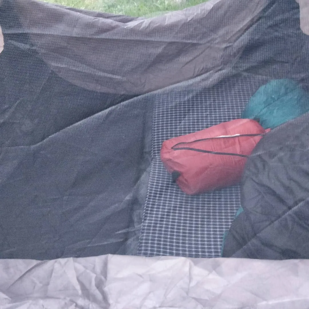 The #tarp is laid out. The instant #tent is popped up. The foam #mattresses have been laid out in the tent. And the sleeping #bags have been thrown in. We move fast inspite of the 