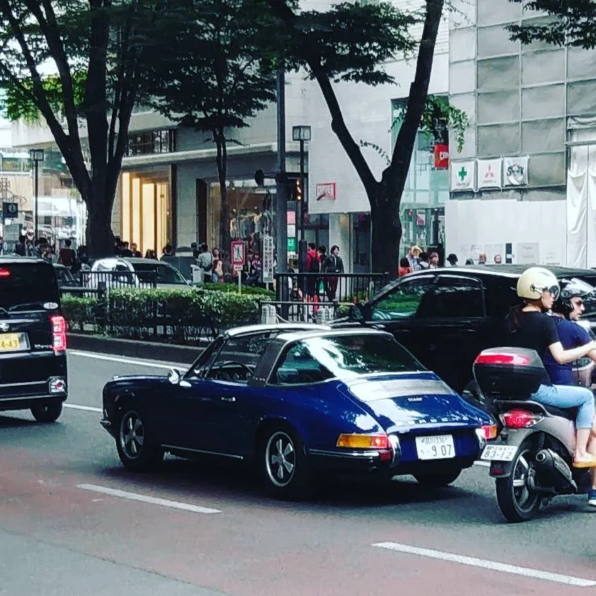 A parade of sports cars on the streets of Shibuya