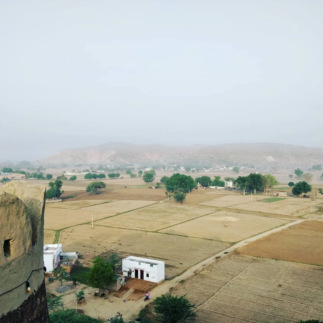 As the sun rises you realise that we humans have been eating away at these majestic, ancient mountains. To the left are the fort walls, built with stone quarried from the mountains