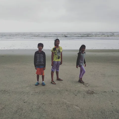 Even though the #children can't venture into the #sea, they are still #excited to see it after a long #road trip.