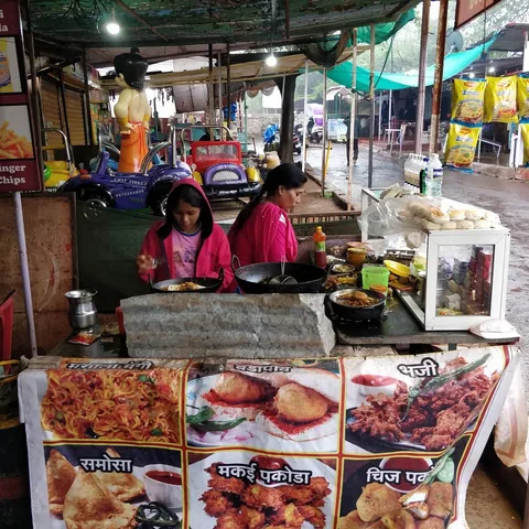 The happiest café owner ever. She was delighted to have the opportunity to feed all the children, and did remarkably wel