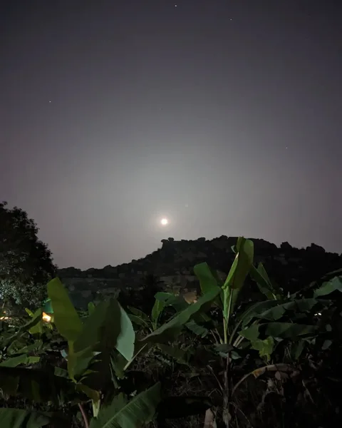 The #moon rises from behind the #rocks that the boys went #bouldering on