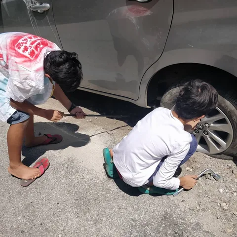 Tyre burst. We moved to the left of the road to allow a vehicle coming uphill to pass. The water pipeline by the side of