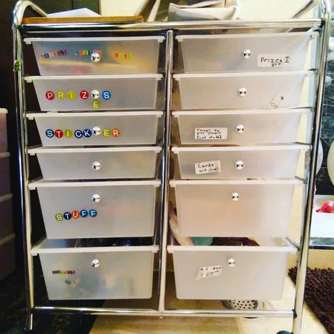 My niece's drawer cabinet. Zoom in for lovely labels such as "cool stuff to give people" and "things I won".