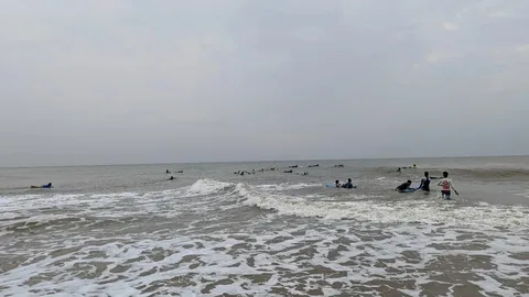 The boys came out of the water last evening, shaken up, but still very excited about toeay. "The waves will be softer in